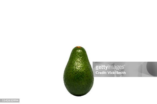 close up photography of a avocado - avocado stock-fotos und bilder