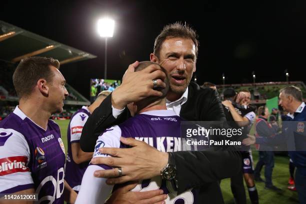 Tony Popovic, head coach of the Glory embraces Neil Kilkenny after winning the Premiers plate during the round 25 A-League match between the Perth...