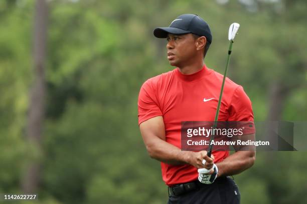 Tiger Woods of the United States plays a shot on the first hole during the final round of the Masters at Augusta National Golf Club on April 14, 2019...