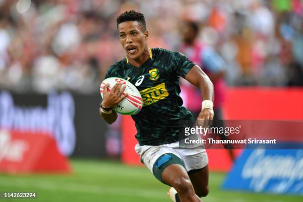 Angelo Davids of South Africa in actions during the Cup Finals between South Africa and Fiji on day two of the HSBC Rugby Sevens Singapore at the...