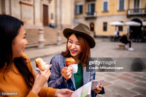 enjoying italian brioche. - milan map stock pictures, royalty-free photos & images