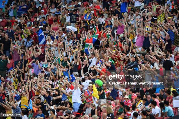 Rugby fan in actions during the Cup Semi Finals between South Africa and USA on day two of the HSBC Rugby Sevens Singapore at the National Stadium on...