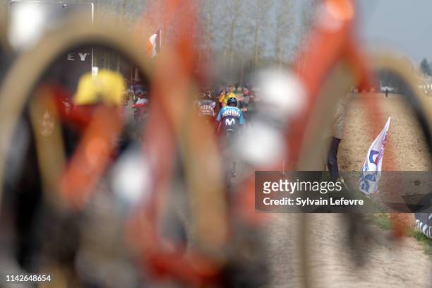 Racers ride the cobblestones sector 9 of Pont Thibaut during the 117th Paris - Roubaix 2019 race from Compiegne to Roubaix on April 14, 2019 in...