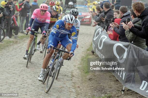 Philippe Gilbert rides the cobblestones sector 9 of Pont Thibaut in Ennevelin during the 117th Paris - Roubaix 2019 race from Compiegne to Roubaix on...
