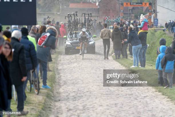 Racers ride the cobblestones sector 9 of Pont Thibaut during the 117th Paris - Roubaix 2019 race from Compiegne to Roubaix on April 14, 2019 in...