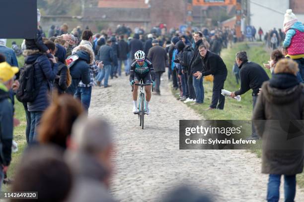 Racers ride the cobblestones sector 9 of Pont Thibaut during the 117th Paris - Roubaix 2019 race from Compiegne to Roubaix on April 14, 2019 in...