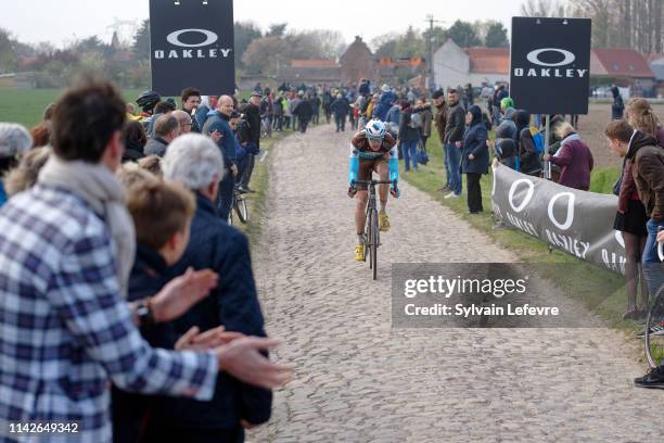 Racers ride the cobblestones sector 9 of Pont Thibaut during the 117th Paris - Roubaix 2019 race from Compiegne to Roubaix on April 14, 2019 in...