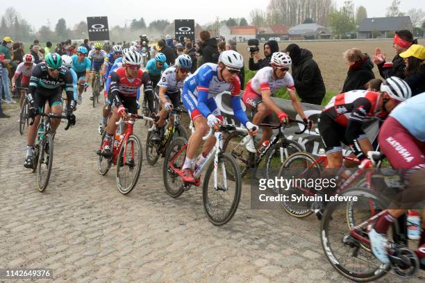 Racers ride the cobblestones sector 9 of Pont Thibaut during the 117th Paris - Roubaix 2019 race from Compiegne to Roubaix on April 14, 2019 in...