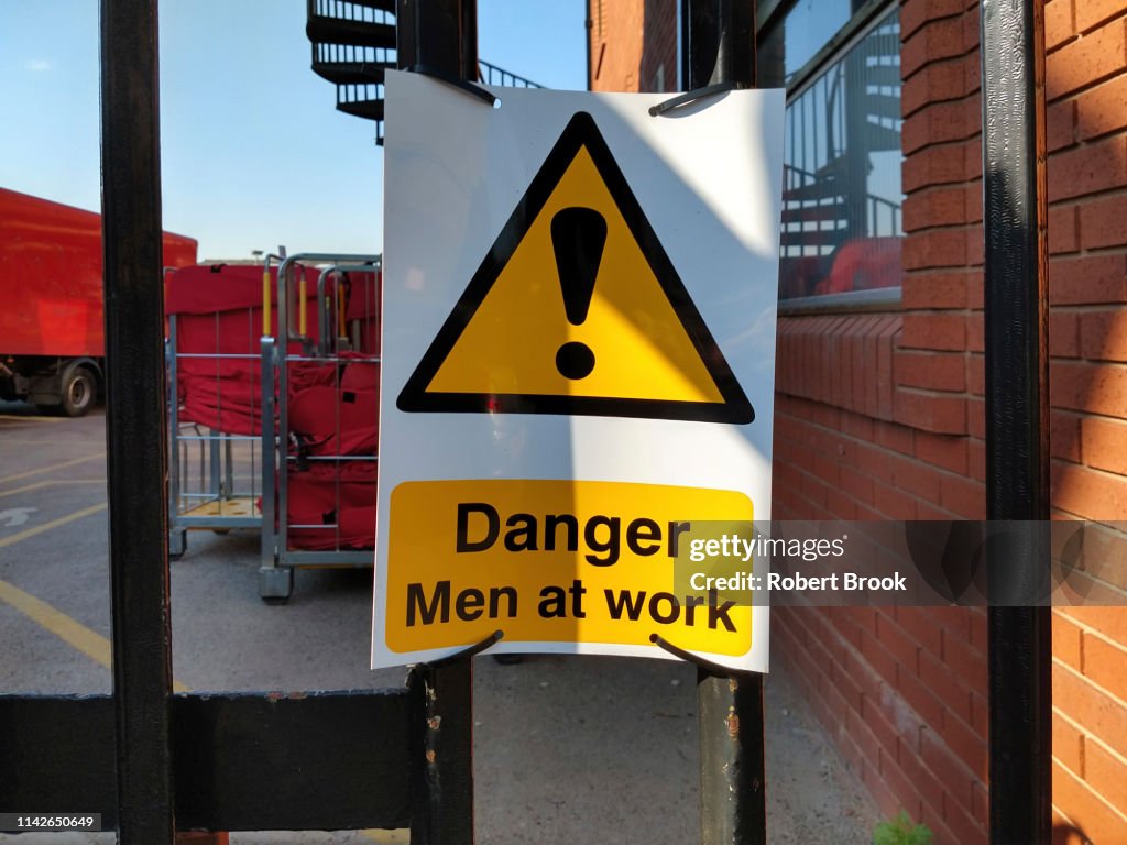 Work At Risk Sign Danger Sign Men At Work High-Res Stock Photo - Getty Images