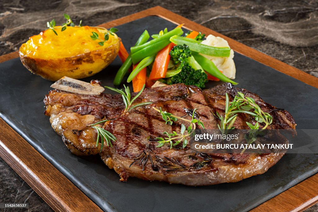 Grilled Steak with Prepared Potato and Steamed Vegetables