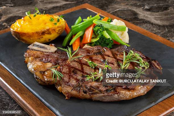 grilled steak with prepared potato and steamed vegetables - paleo diet stock pictures, royalty-free photos & images