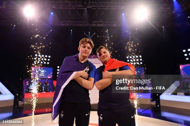 Lucas 'DaXe' Cuillerier of France and Corentin 'MAESTRO' Thullier of France pose for a photo after winning the tournament during Day 2 of FIFA...