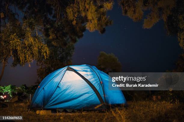camping under the stars - tent night stock pictures, royalty-free photos & images