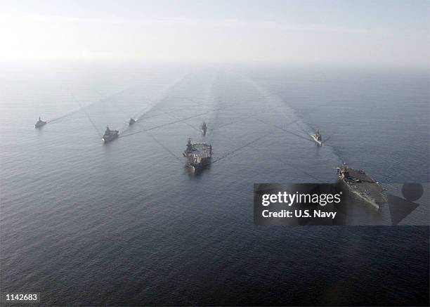 United States aircraft carriers USS Theodore Roosevelt, USS Carl Vinson, and guided missile cruisers USS Vella Gulf, USS Antietam are joined by the...