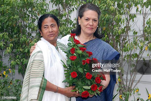 Trinamool Congress Chief Mamata Banerjee is greeted by India's ruling Congress Party President Sonia Gandhi before a meeting at the latter's...