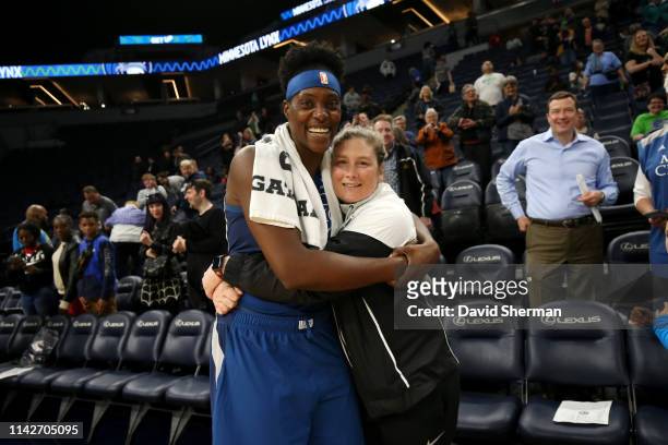 Sylvia Fowles hugs Retired Minnesota Lynx Player Lindsay Whalen after the game against the Washington Mystics on May 10, 2019 at the Target Center in...