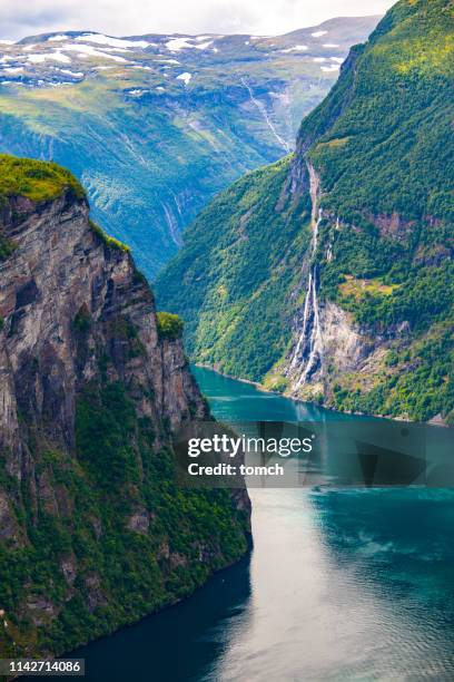 geiranger fjord and seven sisters waterfall. - fjord stock pictures, royalty-free photos & images