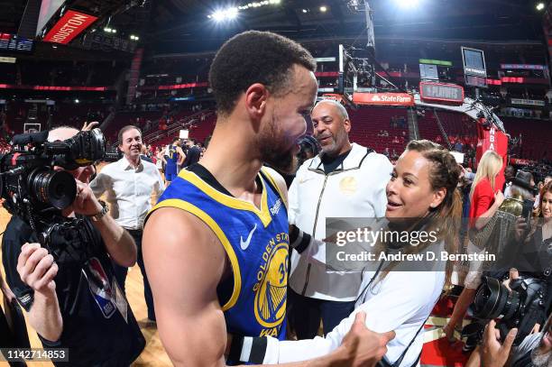 Stephen Curry of the Golden State Warriors and Sonya Curry hug after Game Six of the Western Conference Semifinals against the Houston Rockets during...