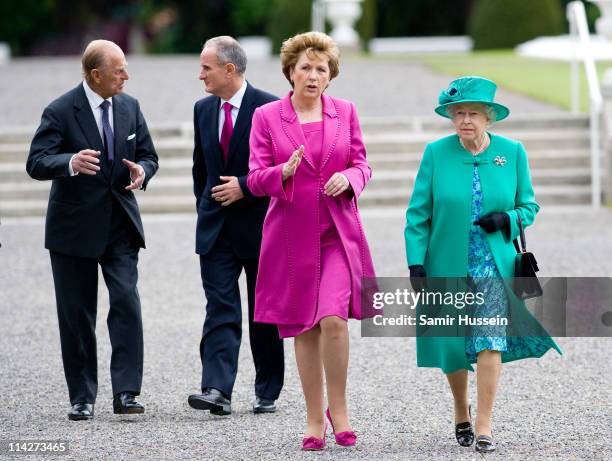 Queen Elizabeth II and Irish President Mary McAleese arrive at Aras an Uachtarain with Prince Philip, Duke of Edinburgh and Martin McAleese on May...