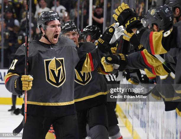 Mark Stone of the Vegas Golden Knights celebrates with teammates on the bench after scoring a third-period goal, his third goal of the game, against...