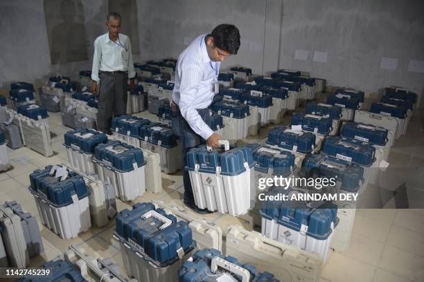 An Indian poll official carries Voter Verified Paper Audit Trail ahead of the Phase VI of India's general election in Agartala, the capital of...