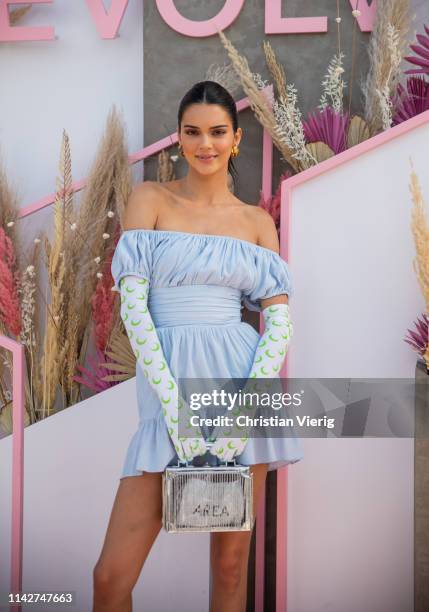 Kendall Jenner is seen wearing blue off shoulder dress, gloves with print at Revolve Festival during Coachella Festival on April 14, 2019 in La...