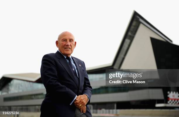 Sir Stirling Moss OBE poses for a photograph during the opening of the Silverstone Wing at Silverstone Circuit on May 17, 2011 in Northampton,...
