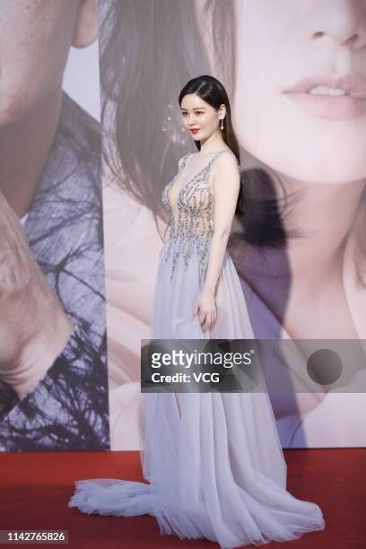 Actress Sabrina Qiu Yinong poses on the red carpet of the 38th Hong Kong Film Awards Ceremony at the Hong Kong Cultural Centre on April 14, 2019 in...