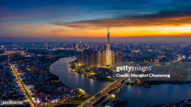 panorama of ho chi minh city skyline at sunset - saigon river fotografías e imágenes de stock