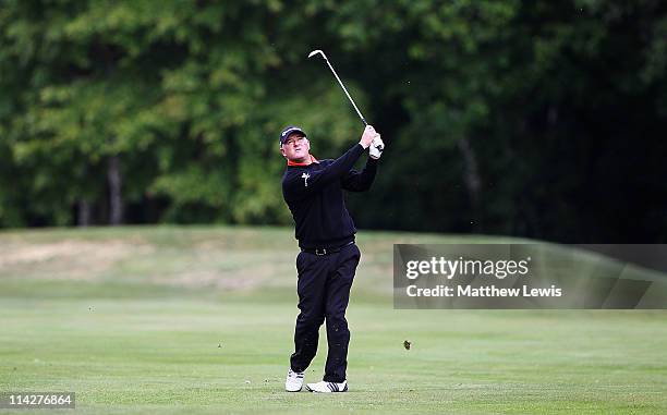 Peter Baker plays a shot from the 16th fairway during the Glenmuir PGA Professional Championship Midland Regional Qualifier at Little Aston Golf Club...