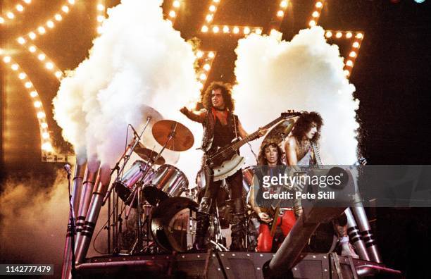 Gene Simmons, Vinnie Vincent and Paul Stanley of American Heavy Metal group KISS perform on stage on the 'Lick It Up' tour, the band's first without...