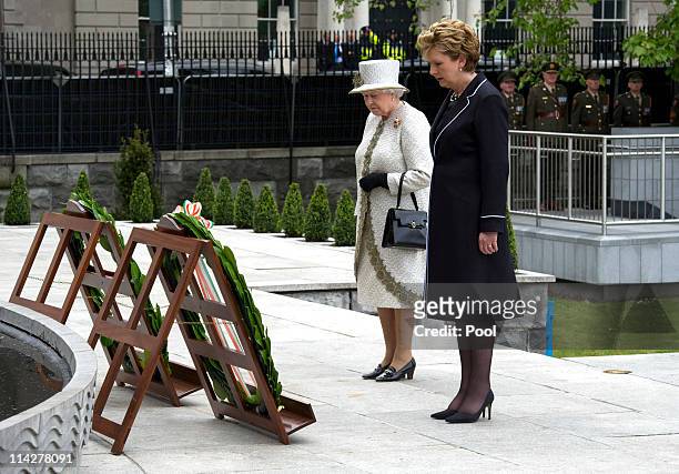 Irish President Mary McAleese and Queen Elizabeth II lay a wreath at Dublin Memorial Garden on May 17, 2011 in Dublin, Ireland. The Duke and Queen's...