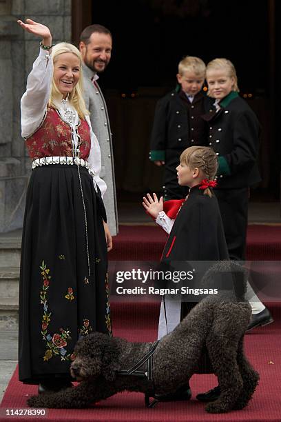 Princess Mette-Marit of Norway and Princess Ingrid Alexandra of Norway attend the Children's Parade with their labradoodle Milly Kakao during...