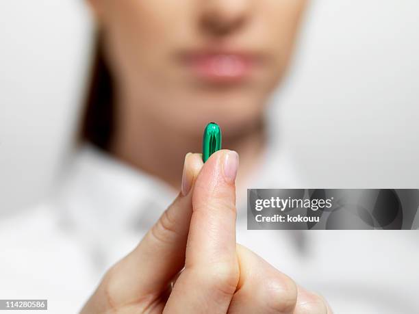 take your medication - finger tablet stock pictures, royalty-free photos & images