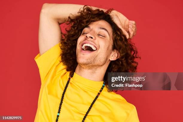 colourful studio portrait of a young man - one man only stock pictures, royalty-free photos & images