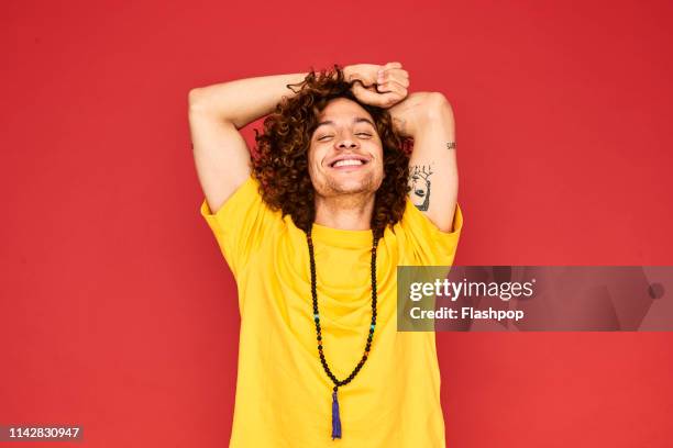 colourful studio portrait of a young man - gay person color background stock pictures, royalty-free photos & images