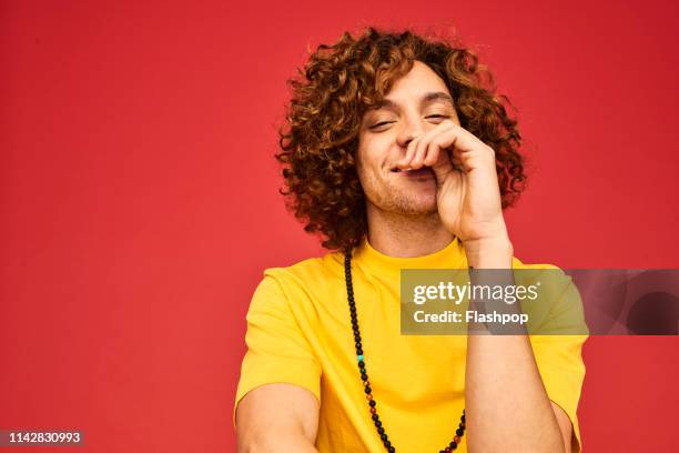 colourful studio portrait of a young man - individuality male stock pictures, royalty-free photos & images