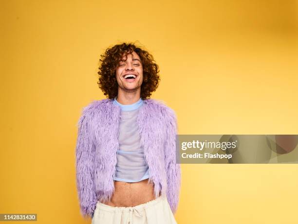 colourful studio portrait of a young man - gay person color background stock pictures, royalty-free photos & images