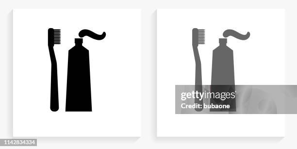 zahnbürste & paste black and white square icon - toothpaste stock-grafiken, -clipart, -cartoons und -symbole