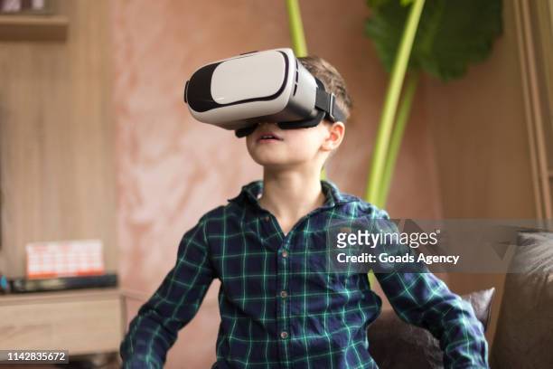 kid wearing virtual reality glasses - vr kids stock pictures, royalty-free photos & images