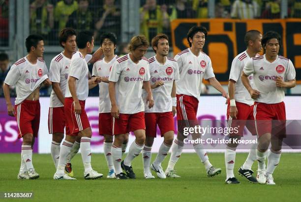 Shinji Kagawa of Japan celebrates the first goal during the charity match between Borussia Dortmund and a Team of Japan at the Schauinsland Reisen...
