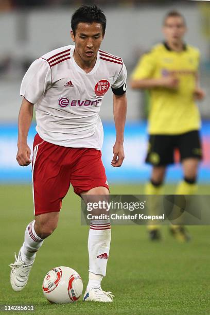 Makoto Hasebe of Japan runs with the ball during the charity match between Borussia Dortmund and a Team of Japan at the Schauinsland Reisen Arena on...