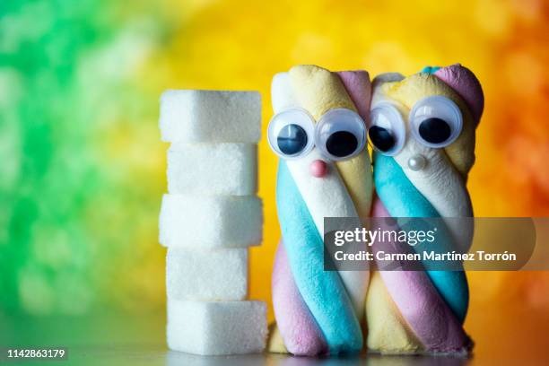 marshmallows with eyes. - puderzucker stock-fotos und bilder
