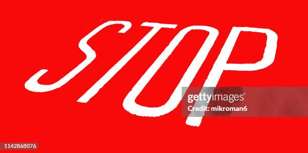 stop sign painted on street - stop single word stock pictures, royalty-free photos & images