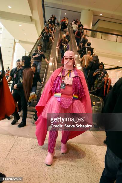 Portrait of a person dressed as a pink version of 'Darth Vader' the Star Wars Celebration event at Wintrust Arena, Chicago, Illinois, April 13, 2019.