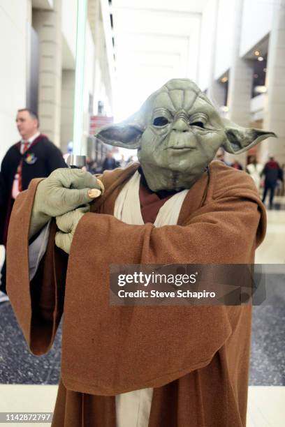 Portrait of a person dressed as 'Yoda' at the Star Wars Celebration event at Wintrust Arena, Chicago, Illinois, April 13, 2019.
