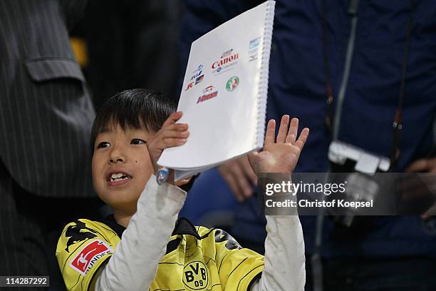 Fans of Japan celebrate their team during the charity match between Borussia Dortmund and a Team of Japan at the Schauinsland Reisen Arena on May 17,...