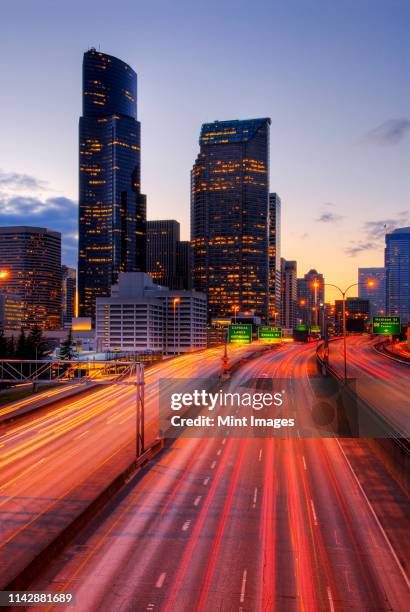 long exposure view of traffic driving on urban highway, seattle, washington, united states - long exposure traffic stock pictures, royalty-free photos & images