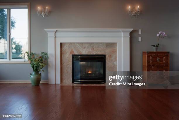 fireplace and mantle in living room - mantel stock pictures, royalty-free photos & images