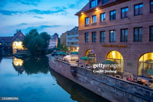 river scenery at dusk of nuremberg, germany - nürnberg rainy stock pictures, royalty-free photos & images